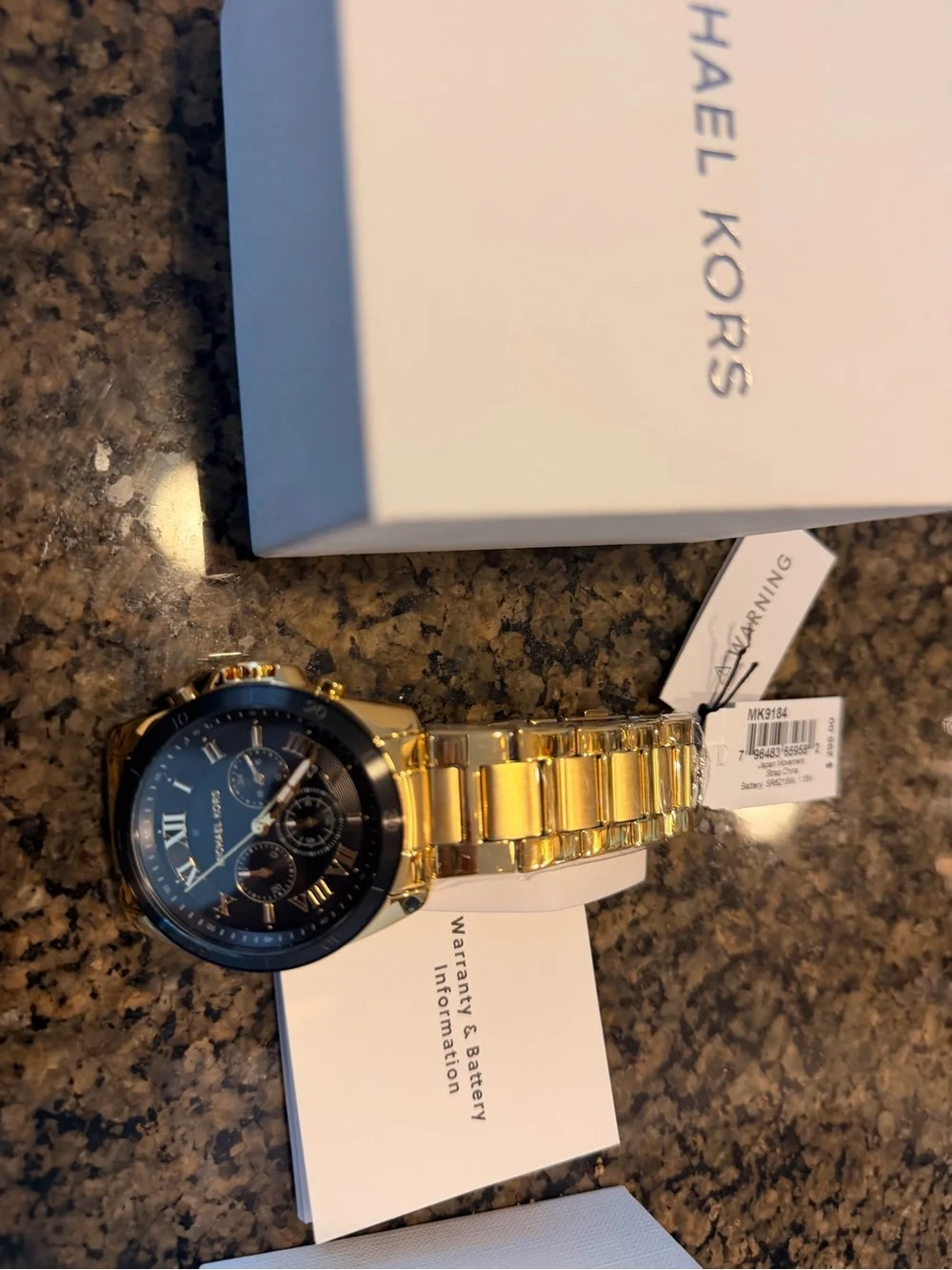Michael Kors gold tone